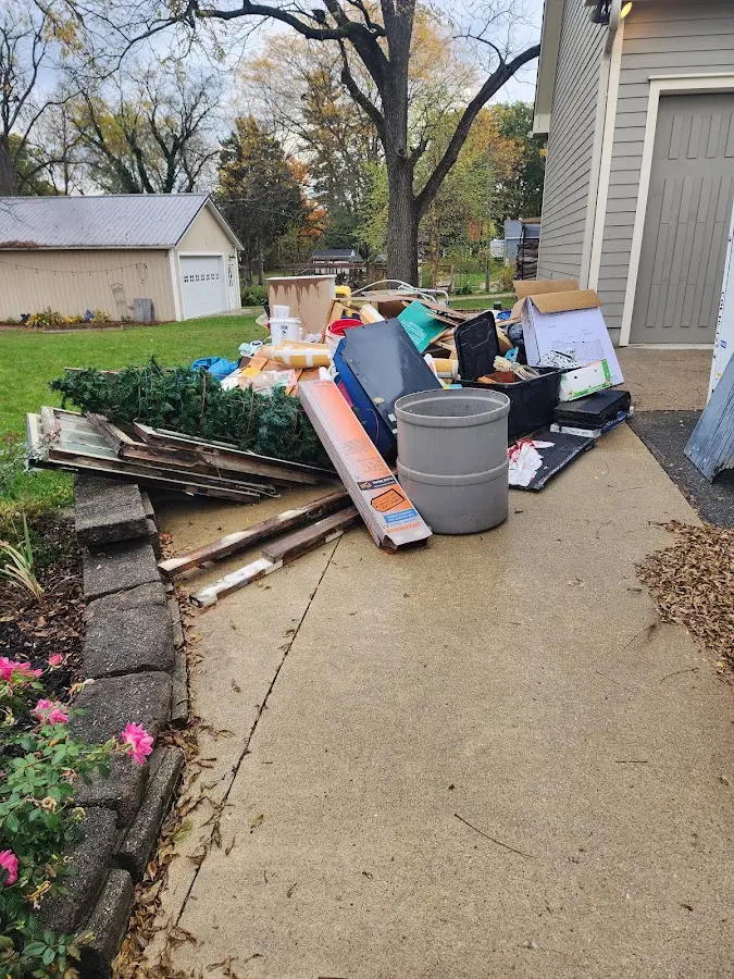 Dumpster being loaded with debris for Roofing Dumpster Rental in Lakeside